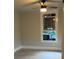 Bedroom featuring new gray laminate flooring, a ceiling fan and a window at 1053 Metropolitan Parkway Southwest Sw Pkwy, Atlanta, GA 30310