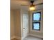 Bedroom with new floors, fresh paint, a ceiling fan, and a window at 1053 Metropolitan Parkway Southwest Sw Pkwy, Atlanta, GA 30310