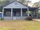 Charming single story home featuring a covered porch, front yard and convenient carport at 1053 Metropolitan Parkway Southwest Sw Pkwy, Atlanta, GA 30310