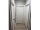 Hallway featuring new gray laminate flooring with closet and two additional doors at 1053 Metropolitan Parkway Southwest Sw Pkwy, Atlanta, GA 30310