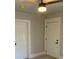 Neutral room with fresh paint, new flooring and white doors, illuminated by a modern ceiling fan at 1053 Metropolitan Parkway Southwest Sw Pkwy, Atlanta, GA 30310