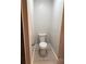 Close-up view of the updated toilet with new floors and baseboards in the bathroom at 1053 Metropolitan Parkway Southwest Sw Pkwy, Atlanta, GA 30310
