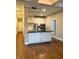 Kitchen featuring an island, hardwood floors, and stainless steel appliances perfect for modern cooking and dining at 2840 Peachtree Road Nw Nw Rd # 306, Atlanta, GA 30305
