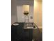 Modern kitchen sink with marble countertops and stylish faucet under a window-like pass-through feature at 2840 Peachtree Road Nw Nw Rd # 306, Atlanta, GA 30305