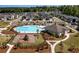 A beautiful aerial view of a neighborhood with a pool, clubhouse, and playground at 4065 Holland Grove Rd, Lawrenceville, GA 30044
