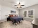 A well-lit bedroom with neutral tones, a comfortable bed, and a large window at 4065 Holland Grove Rd, Lawrenceville, GA 30044