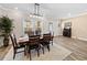 Dining room with wood table, modern light fixture, and an abstract art piece at 4065 Holland Grove Rd, Lawrenceville, GA 30044