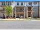 Townhome exteriors with brick and white siding at 4065 Holland Grove Rd, Lawrenceville, GA 30044