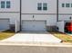 Attached two car garage with a driveway at 4065 Holland Grove Rd, Lawrenceville, GA 30044