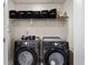 Laundry room with modern washer and dryer, and overhead storage at 4065 Holland Grove Rd, Lawrenceville, GA 30044