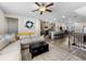 Open-concept living room with a large sectional sofa and view of the kitchen and dining area at 4065 Holland Grove Rd, Lawrenceville, GA 30044