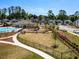 Community playground with swings, slides, and nearby pool area at 4065 Holland Grove Rd, Lawrenceville, GA 30044