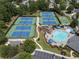 Aerial view of the community pool, tennis courts, and playground offering recreational opportunities at 475 Chippenham Ct, Alpharetta, GA 30005