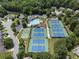 Aerial view of a community pool and tennis courts, promoting an active lifestyle at 475 Chippenham Ct, Alpharetta, GA 30005