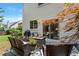 Inviting backyard patio with grill, fire pit, and outdoor seating area at 475 Chippenham Ct, Alpharetta, GA 30005