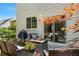 Outdoor patio area with grill, lush grass and privacy landscaping at 475 Chippenham Ct, Alpharetta, GA 30005