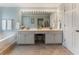 Elegant bathroom features a double vanity, ample lighting, a large mirror, and a soaking tub for relaxation at 475 Chippenham Ct, Alpharetta, GA 30005