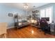 Bright bedroom with hardwood floors, bunk bed, desk, and window creating a comfortable space for rest and study at 475 Chippenham Ct, Alpharetta, GA 30005
