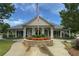 Community clubhouse with landscaped entrance and beautiful architectural details at 475 Chippenham Ct, Alpharetta, GA 30005
