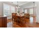 Elegant dining room with hardwood floors and a modern chandelier at 475 Chippenham Ct, Alpharetta, GA 30005