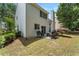 Home exterior featuring a cozy backyard patio with fire pit and grill at 475 Chippenham Ct, Alpharetta, GA 30005