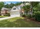 A beautiful two-story home with a well-maintained lawn and an attached two-car garage at 475 Chippenham Ct, Alpharetta, GA 30005