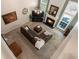 Spacious living room boasts a cozy fireplace, large windows, and ample seating on a stylish, oversized sectional sofa at 475 Chippenham Ct, Alpharetta, GA 30005