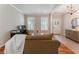 Cozy living room with hardwood floors, bright windows, and an inviting atmosphere at 475 Chippenham Ct, Alpharetta, GA 30005