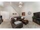 Bright living room featuring large windows, comfortable seating, tall ceilings, and modern decor at 475 Chippenham Ct, Alpharetta, GA 30005