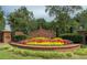 Wellington neighborhood entrance sign with colorful flower bed at 475 Chippenham Ct, Alpharetta, GA 30005