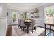Formal dining room with hardwood floors, natural light and wainscoting at 6300 Brookside Pl, Roswell, GA 30076