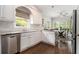 Bright kitchen with stainless steel appliances, white cabinets, and eat-in area at 6300 Brookside Pl, Roswell, GA 30076