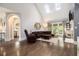 Bright living room with vaulted ceiling, skylights, hardwood floors, and fireplace at 6300 Brookside Pl, Roswell, GA 30076