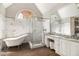 Elegant bathroom with a soaking tub, glass-enclosed shower, and marble accents at 6300 Brookside Pl, Roswell, GA 30076