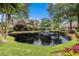 Serene community pond featuring a fountain and beautifully landscaped surroundings at 6300 Brookside Pl, Roswell, GA 30076