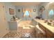 Well-lit bathroom featuring an inviting jacuzzi tub and decorative tile flooring for a luxurious experience at 7133 Babbling Brook Dr, Jonesboro, GA 30236