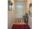 Inviting entryway with a decorative front door, a patterned rug, and light pink colored walls at 7133 Babbling Brook Dr, Jonesboro, GA 30236