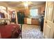 Functional kitchen with wooden cabinets, modern appliances, and a view of dining area at 7133 Babbling Brook Dr, Jonesboro, GA 30236