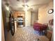Efficient kitchen with wood cabinets, modern appliances, and tile floors adjacent to dining area at 7133 Babbling Brook Dr, Jonesboro, GA 30236