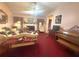 Cozy living room featuring a fireplace, comfortable seating, and a vintage piano at 7133 Babbling Brook Dr, Jonesboro, GA 30236
