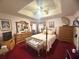 Spacious main bedroom with a tray ceiling, ample closet space, and classic furniture at 7133 Babbling Brook Dr, Jonesboro, GA 30236