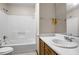 Bathroom with white tub/shower combo and single sink vanity at 1587 Cronic Town Rd, Auburn, GA 30011