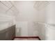 This walk-in closet with wire shelving offers a simple storage solution, but requires renovations and improvements at 1587 Cronic Town Rd, Auburn, GA 30011