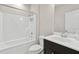 Clean bathroom featuring a shower-tub combo, toilet, and a vanity with a dark cabinet at 1954 Summit Trace Circle Northwest, Atlanta, GA 30318