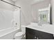 Bright bathroom with white tub/shower combo and vanity with marble countertop at 1954 Summit Trace Circle Northwest, Atlanta, GA 30318