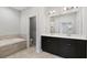 Bathroom with double vanity and tile surround tub at 1954 Summit Trace Circle Northwest, Atlanta, GA 30318