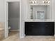 Bathroom with tile floors, dual sinks, and large mirror at 1954 Summit Trace Circle Northwest, Atlanta, GA 30318