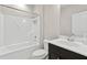 Clean bathroom featuring a combination tub and shower and vanity with storage at 1954 Summit Trace Circle Northwest, Atlanta, GA 30318