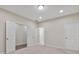 A spacious bedroom with neutral walls, plush carpet, and multiple entryways for flexible living at 1954 Summit Trace Circle Northwest, Atlanta, GA 30318