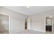 Neutral-toned bedroom with access to an en-suite bathroom and a large walk-in closet at 1954 Summit Trace Circle Northwest, Atlanta, GA 30318